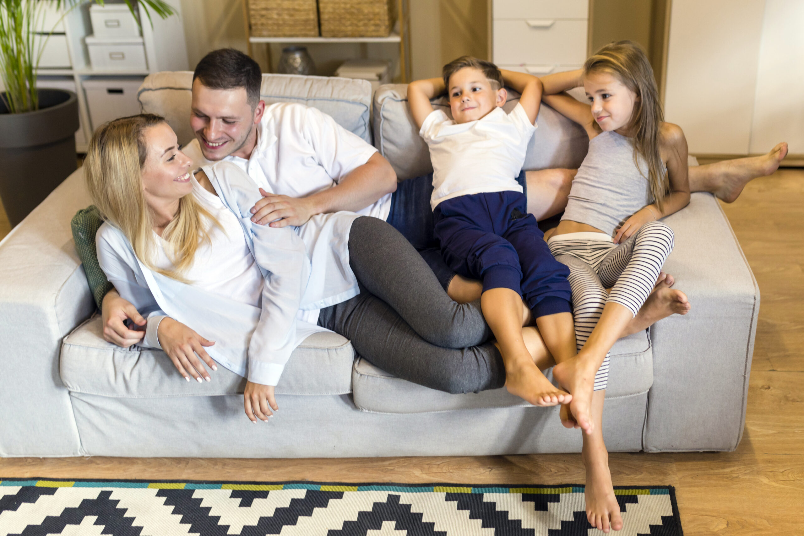 Happy Family in a warm House after Power Flush London solved Central Heating System